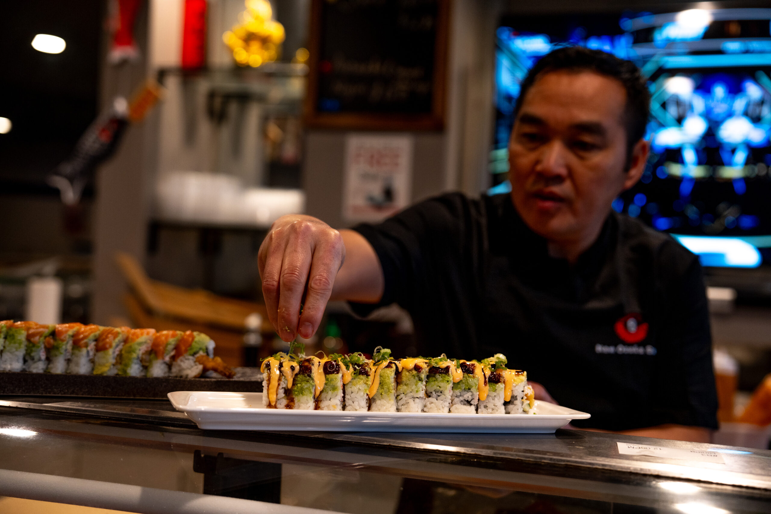 Jacky Ye, owner and head chef of New Osaka Sushi in Sacramento, preparing a signature dish.