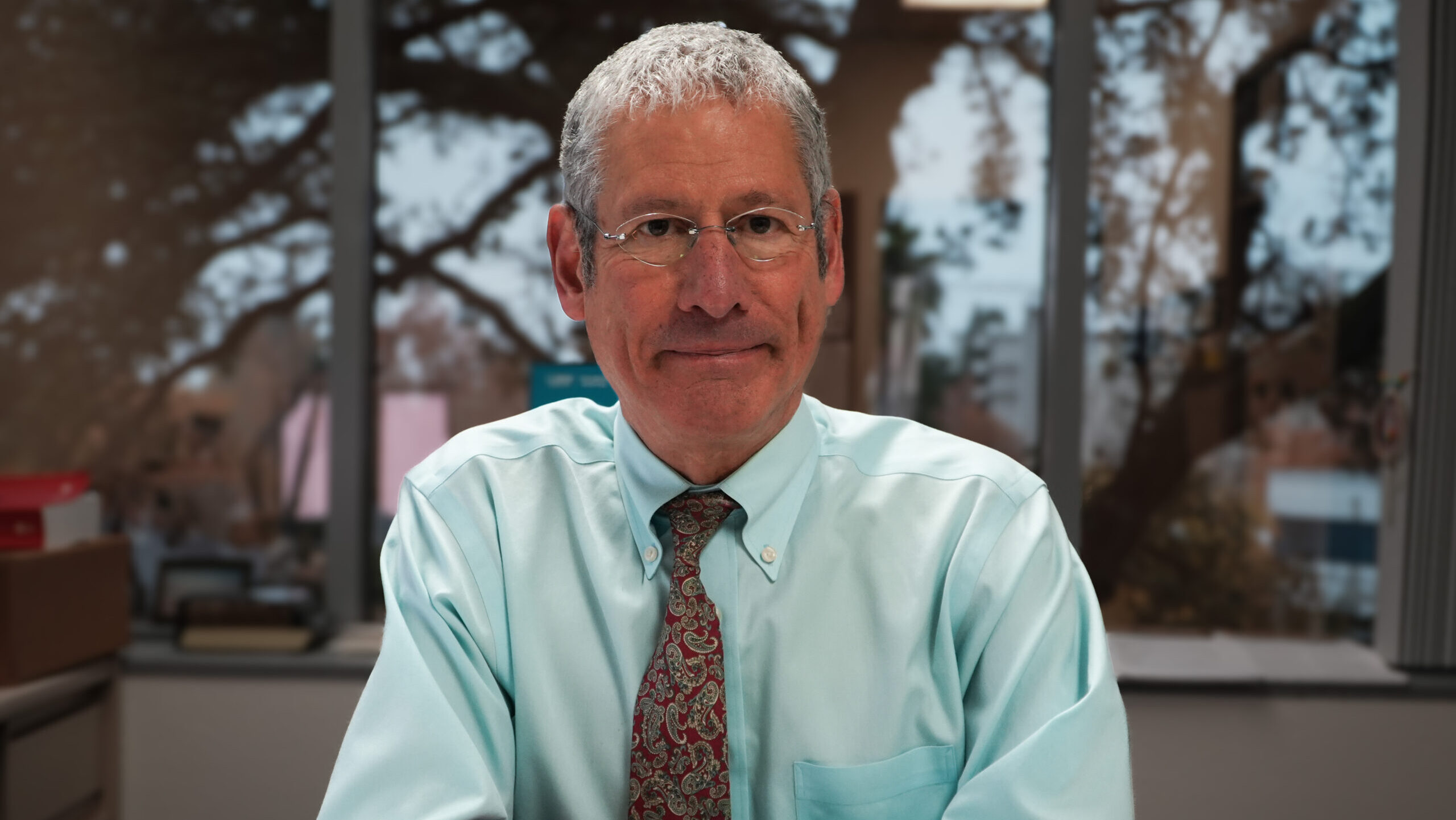 Dr. sitting at a table