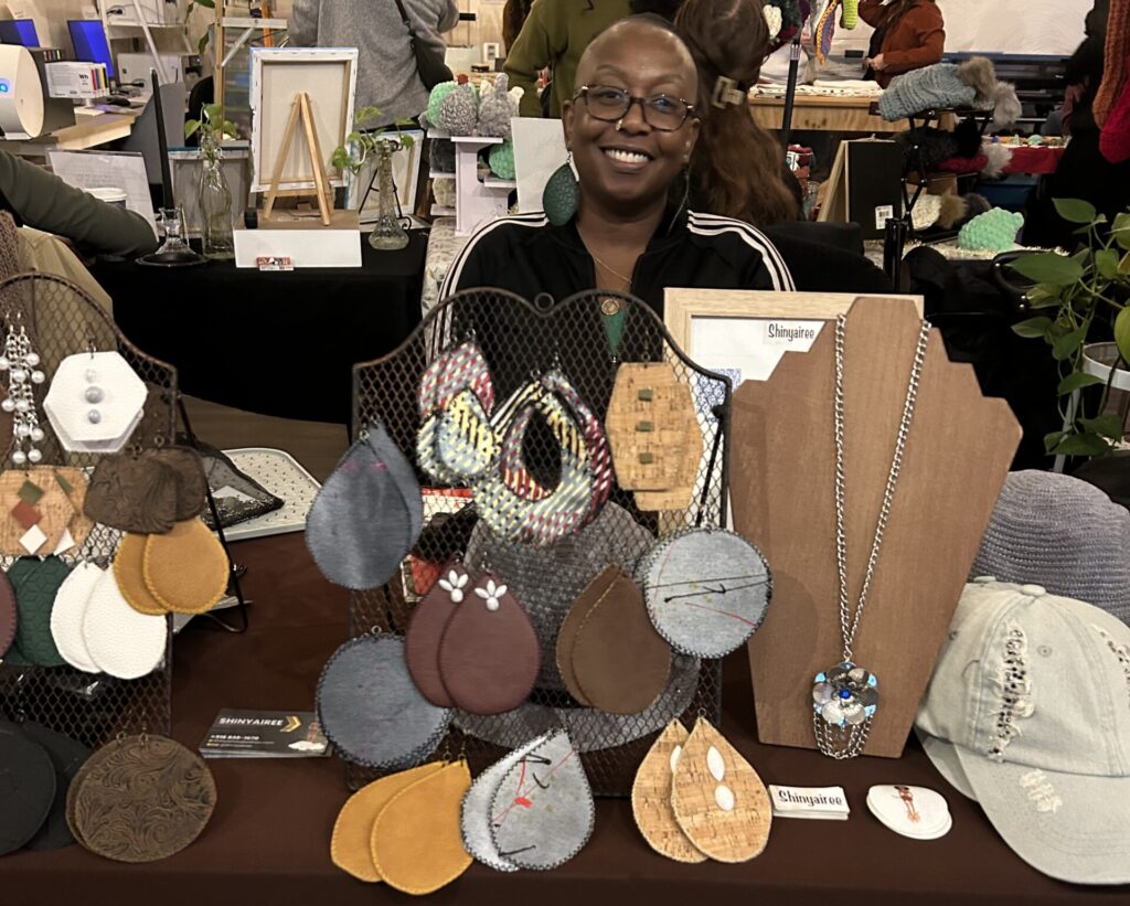 Woman in front of jewelry table