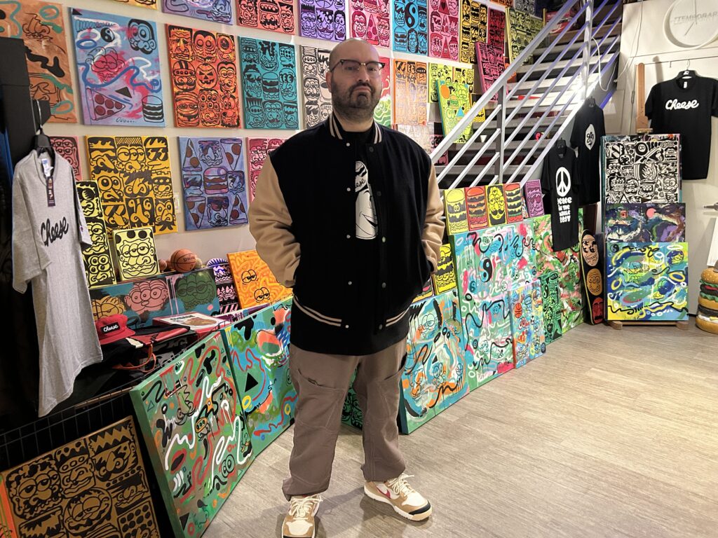 Man stands in front of art