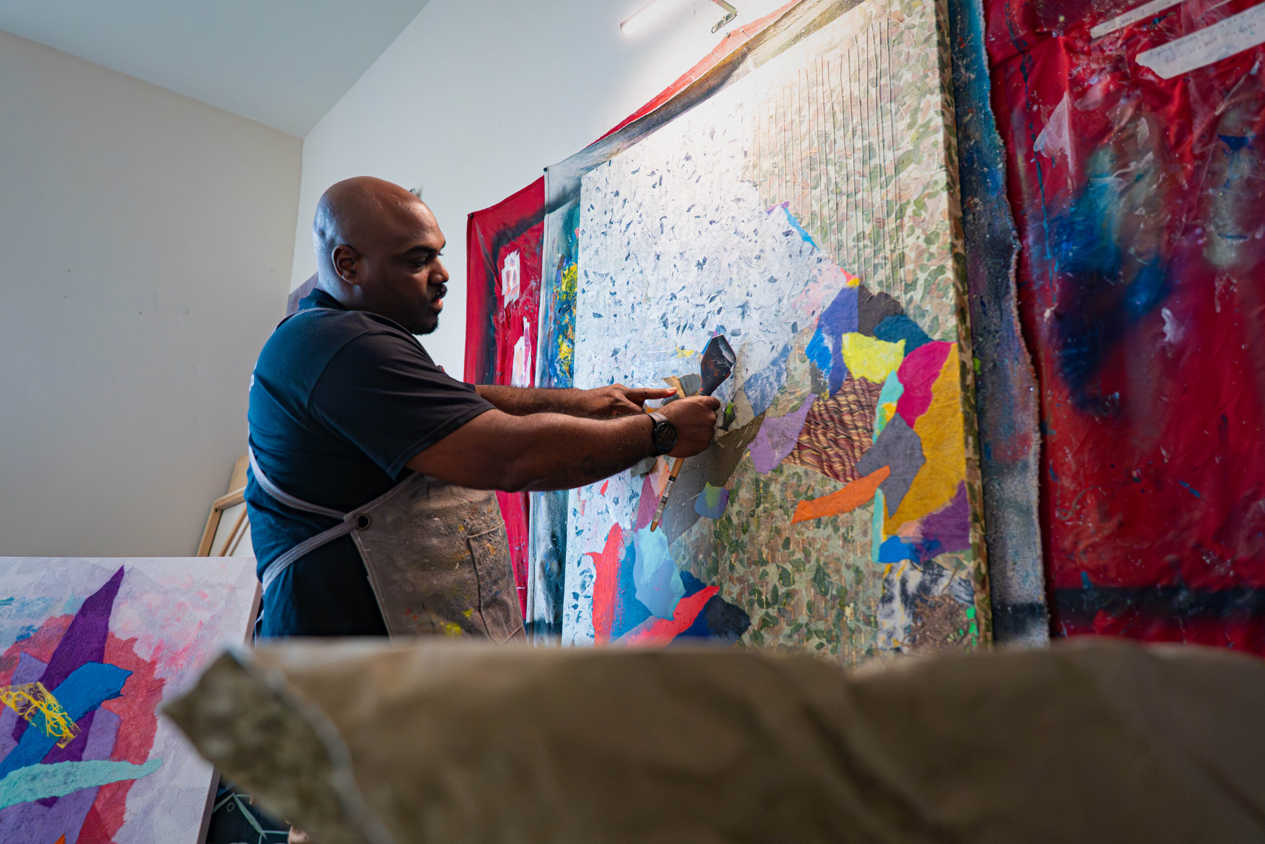 man working on painting