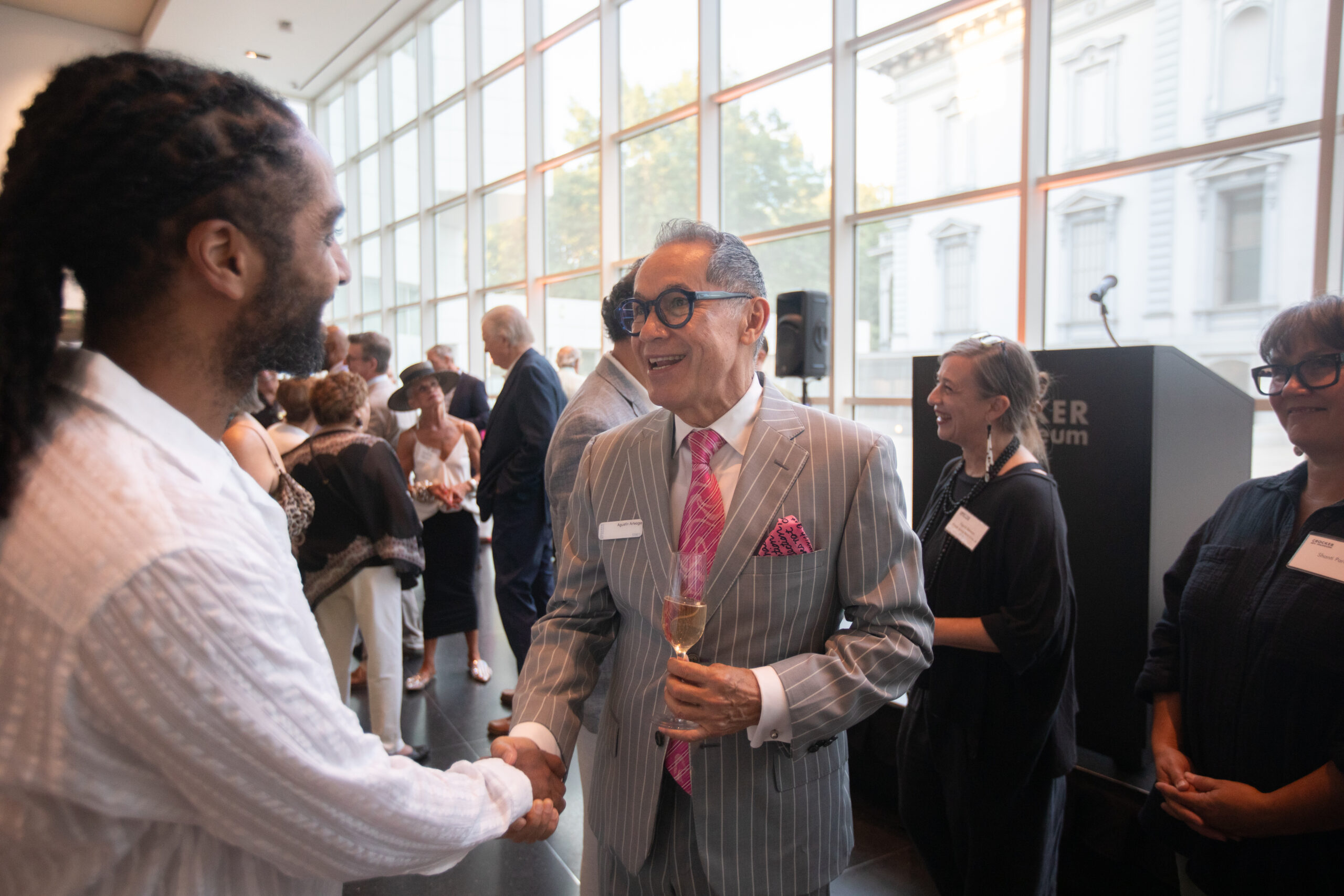 Mort and Marcy Friedman Director & CEO Agustín Arteaga greeting members at the Crocker Art Museum.