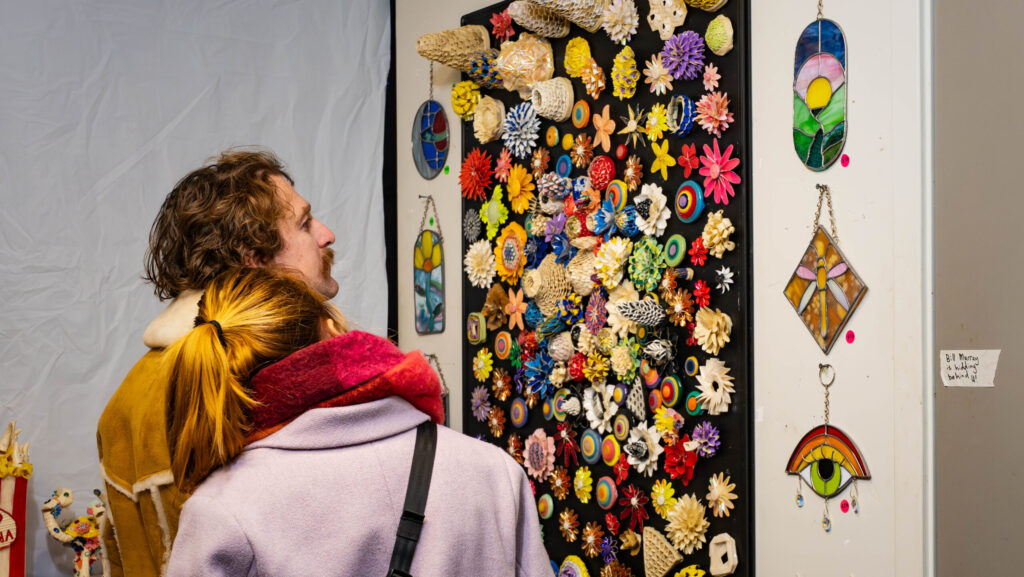 shoppers looking at artwork