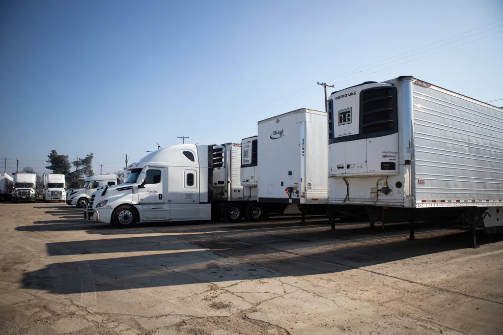 A row of semi-trucks and trailers at the Gillson Trucking Inc. facility in Stockton on Jan. 16, 2026.