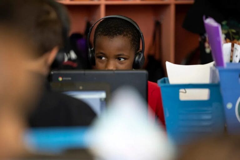 Students use computers in a classroom at a school on May 11, 2022.