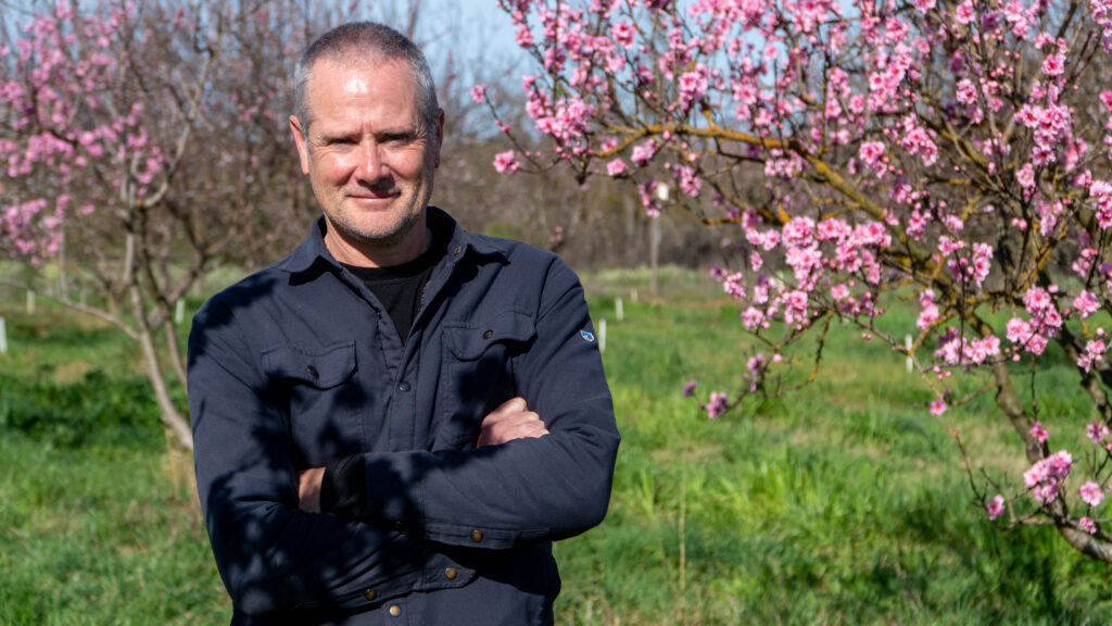 Man in front of tree