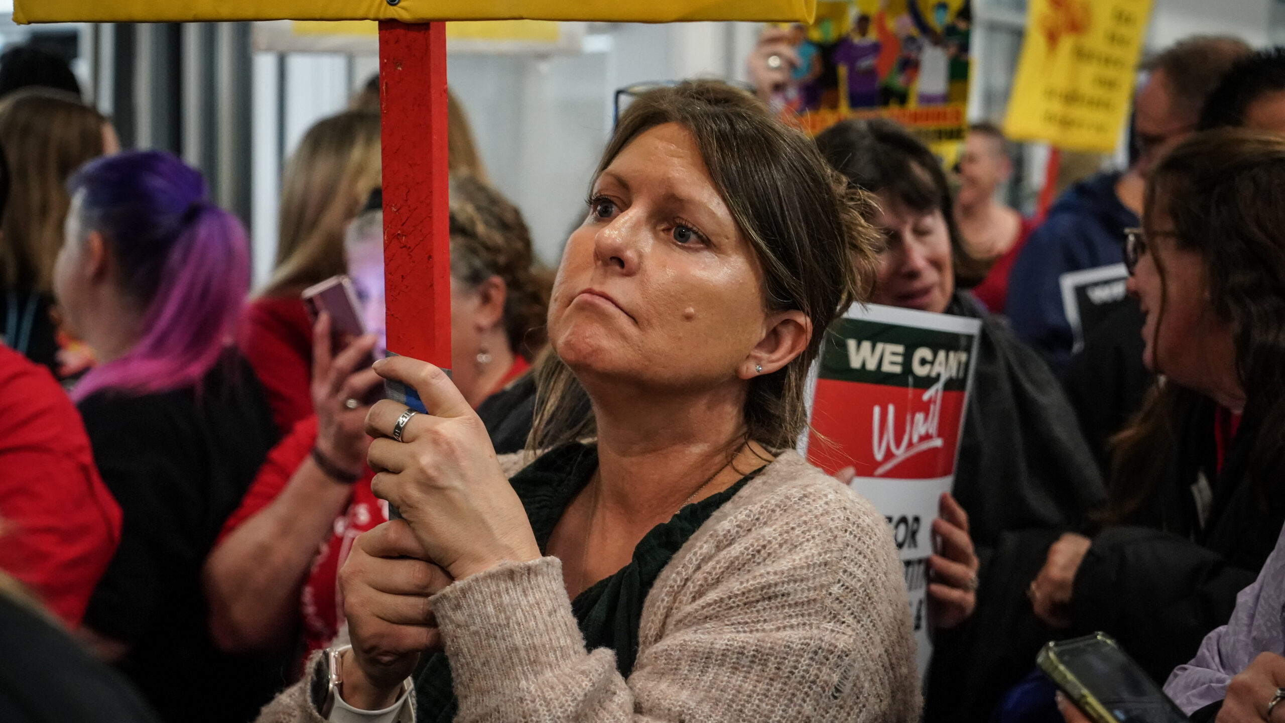 Woman holding picket sign