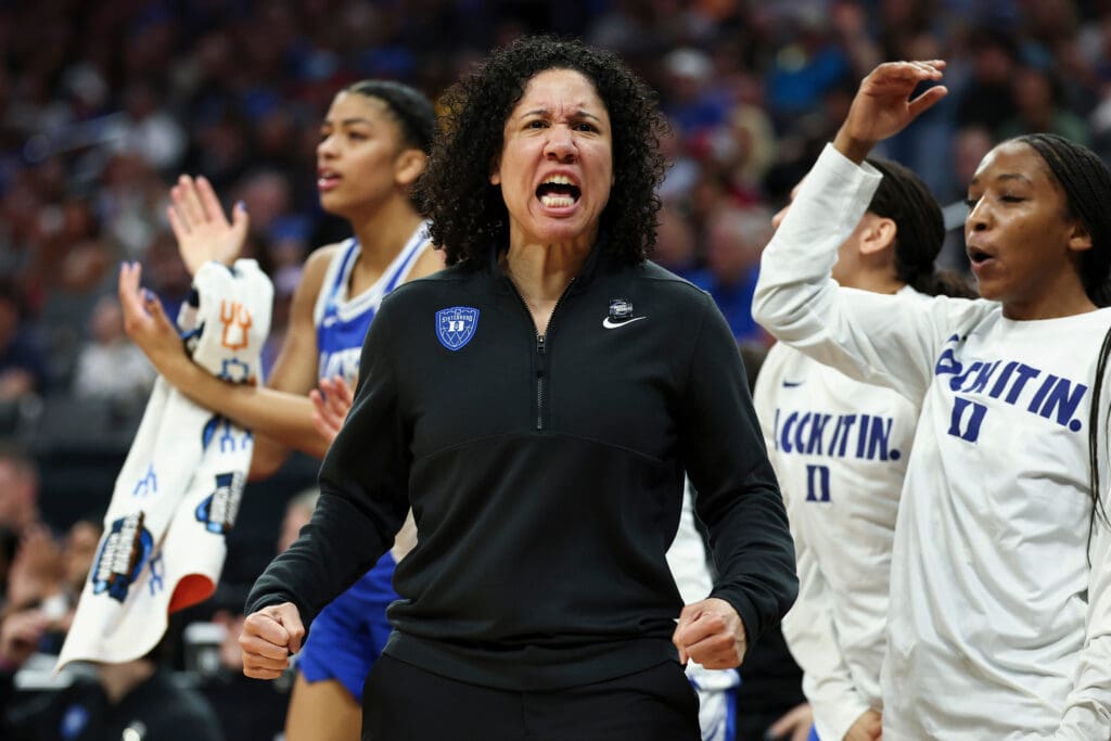 Women's basketball coach celebrates
