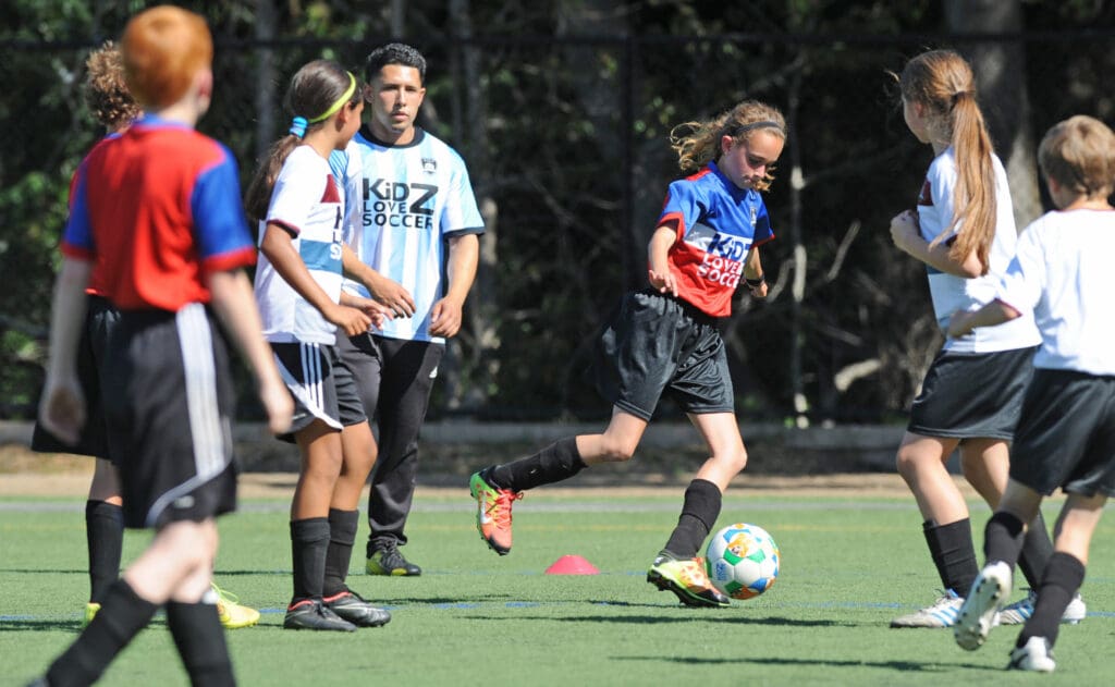 Kids play soccer