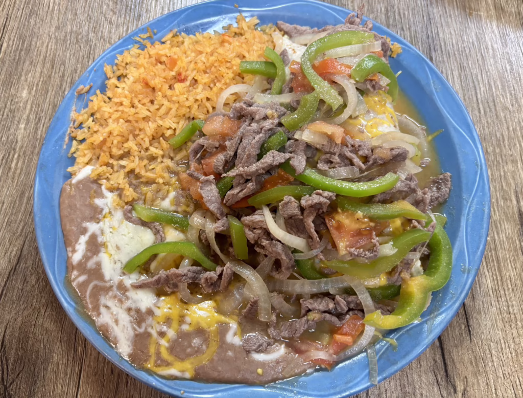 A burrito plate with beans and rice