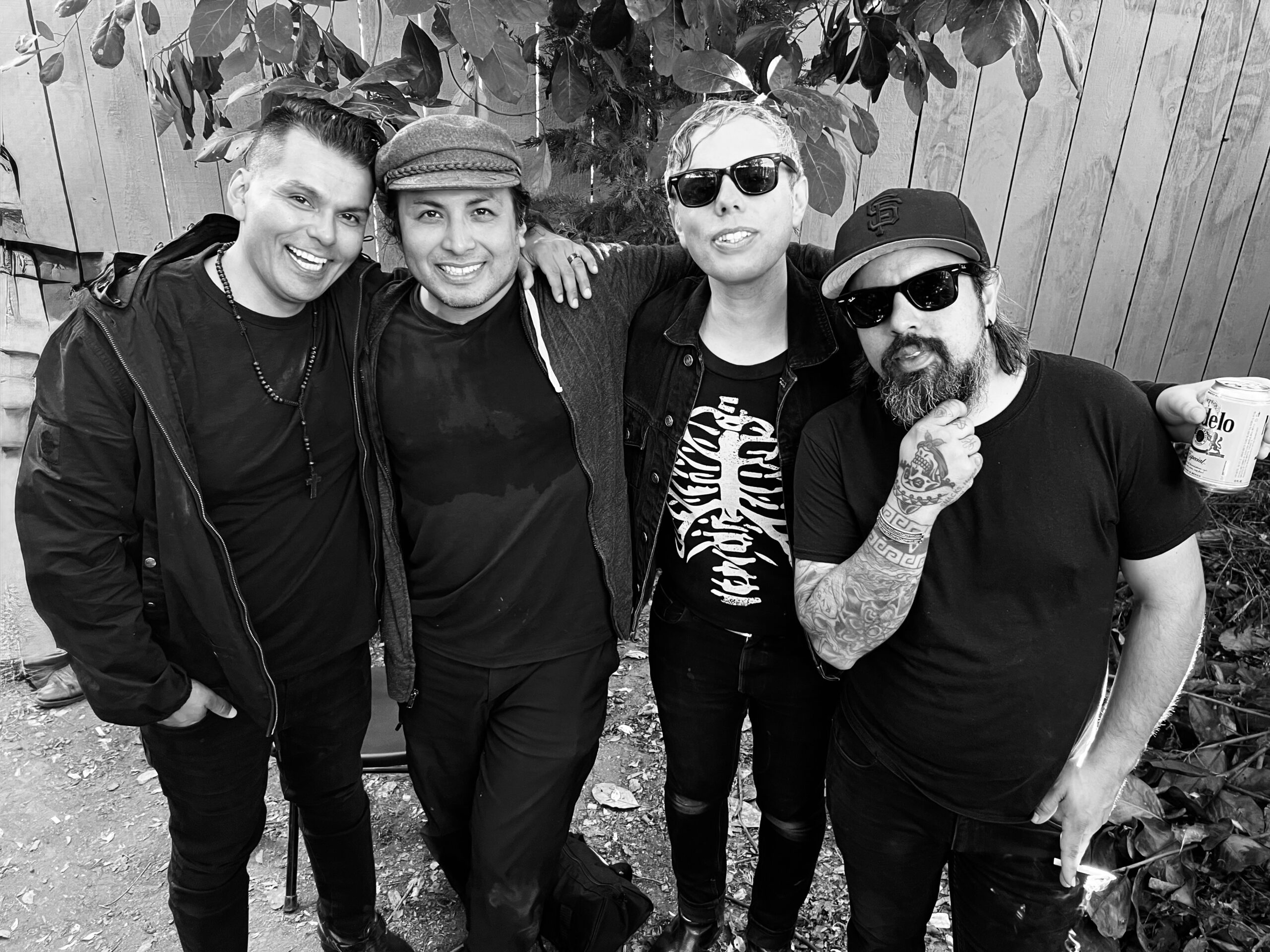 Black and white photo of four men