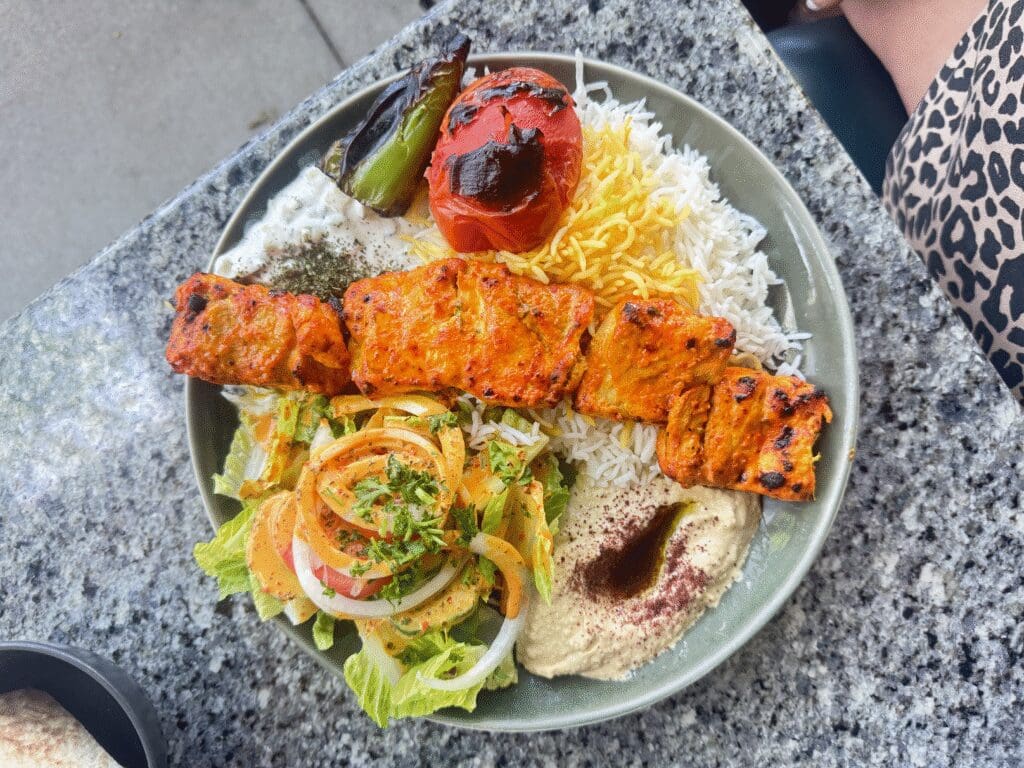 The Taste of Maydoon comes with your choice of kabob, rice, hummus, salad and warm pita.