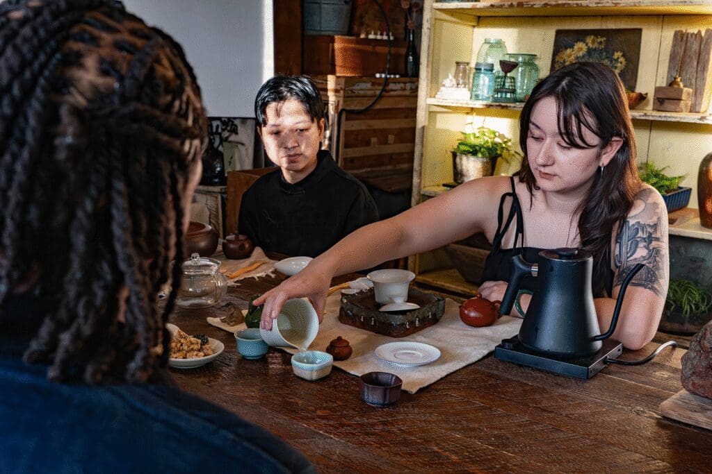 person pouring tea