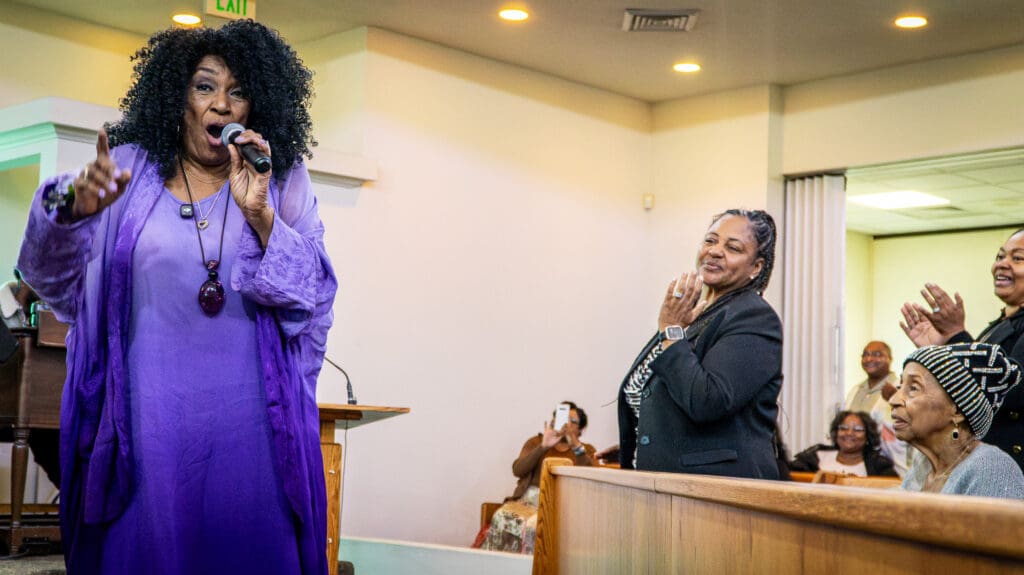 woman singing at church