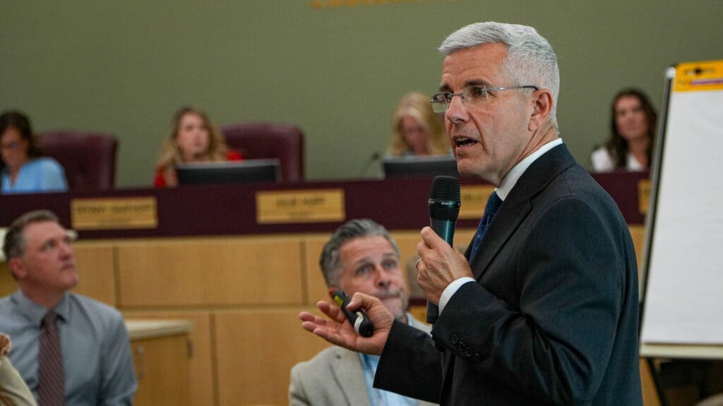 man speaking at meeting