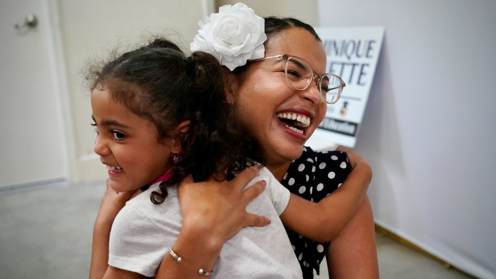 Woman hugs child