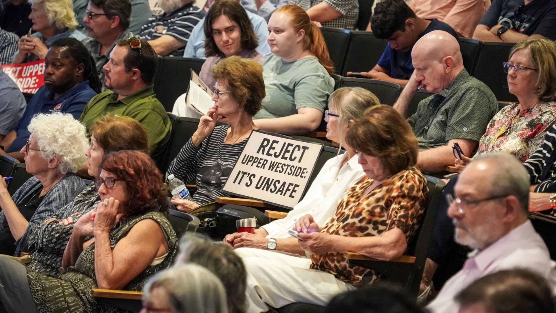 Crowd with sign