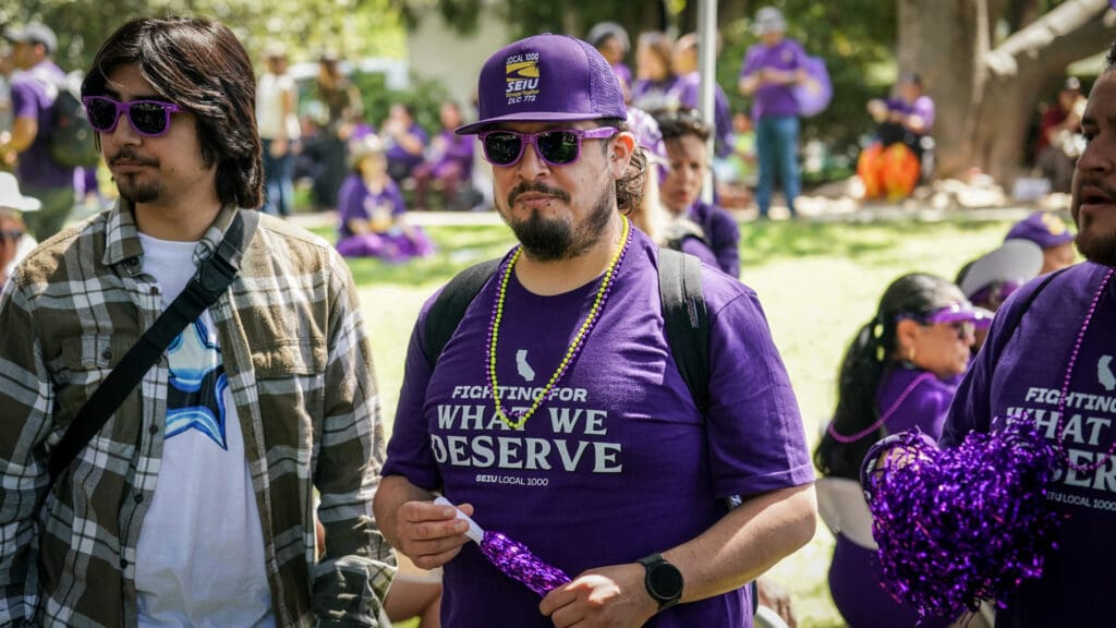 Man listens to speakers