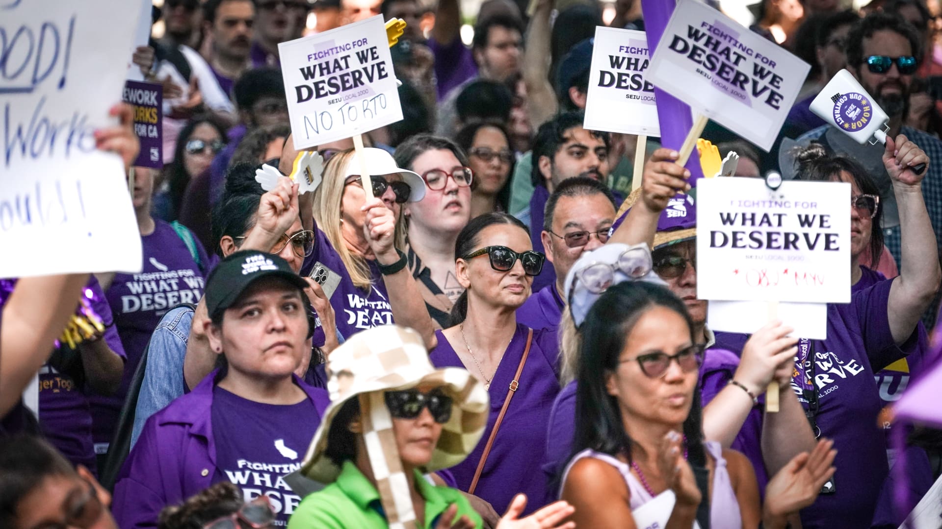 People holding signs at union rally
