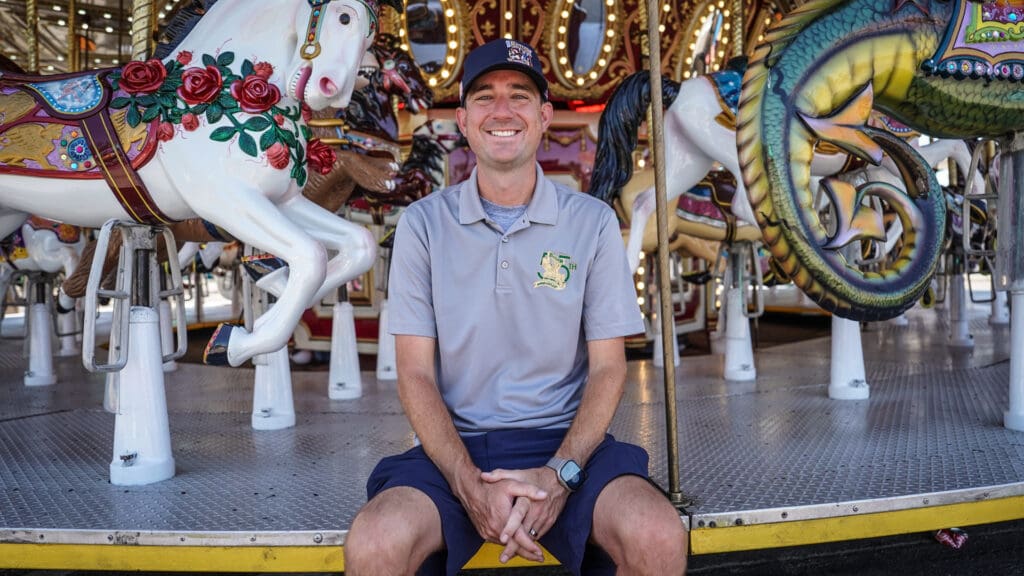 Man sitting on carousel
