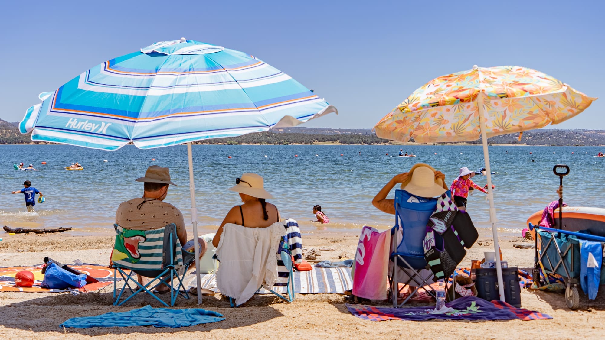 People sit at a beach
