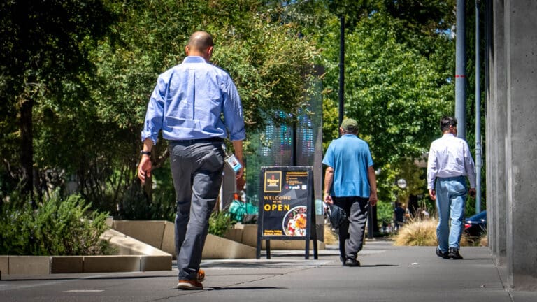 Office workers walk downtown