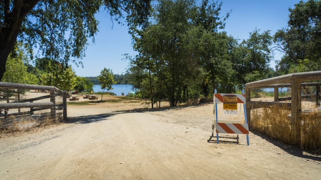 caution sign at lake entry