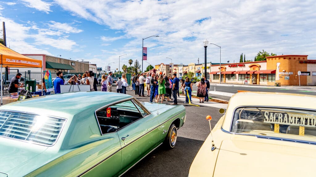 Cars and people gather