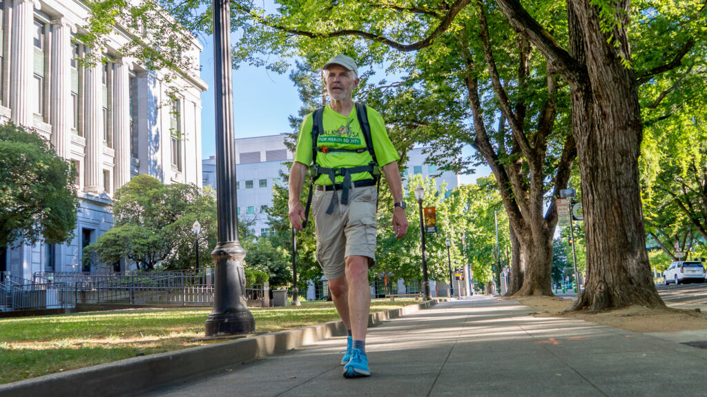 man walking on sidewalk