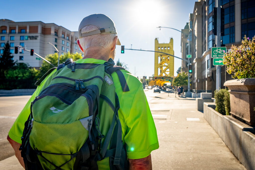 man walking on sidewalk