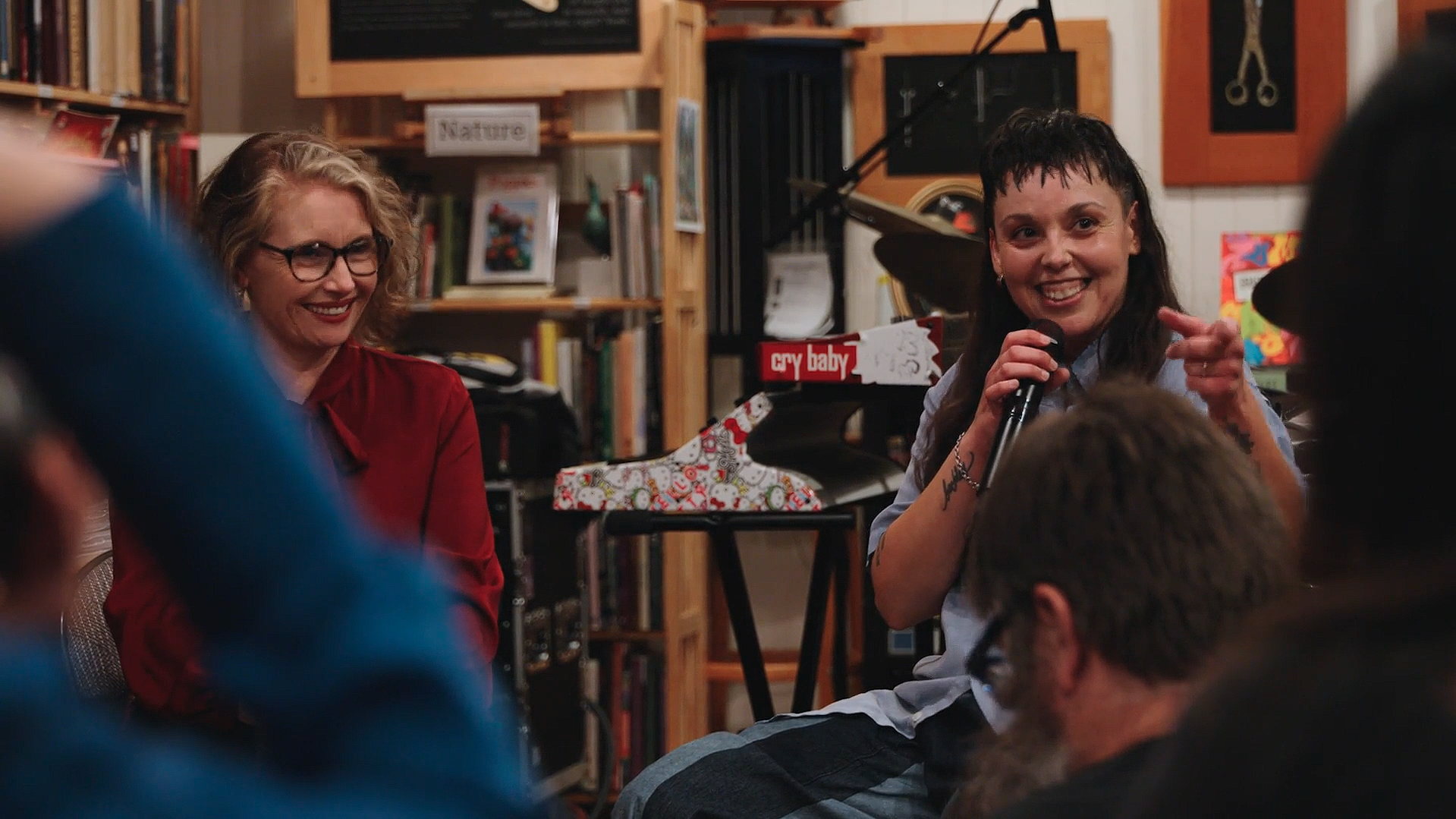 Miranda Culp and Terra Lopez smiling at audience during conversation at The Stacks.