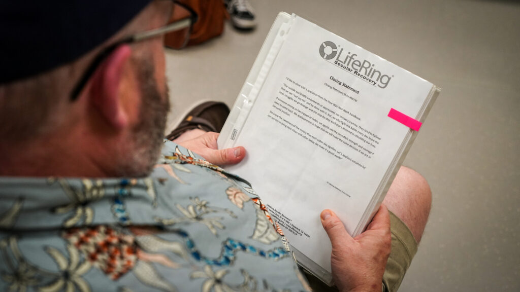 Man holds a binder