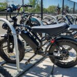 black e-bike on school bike rack