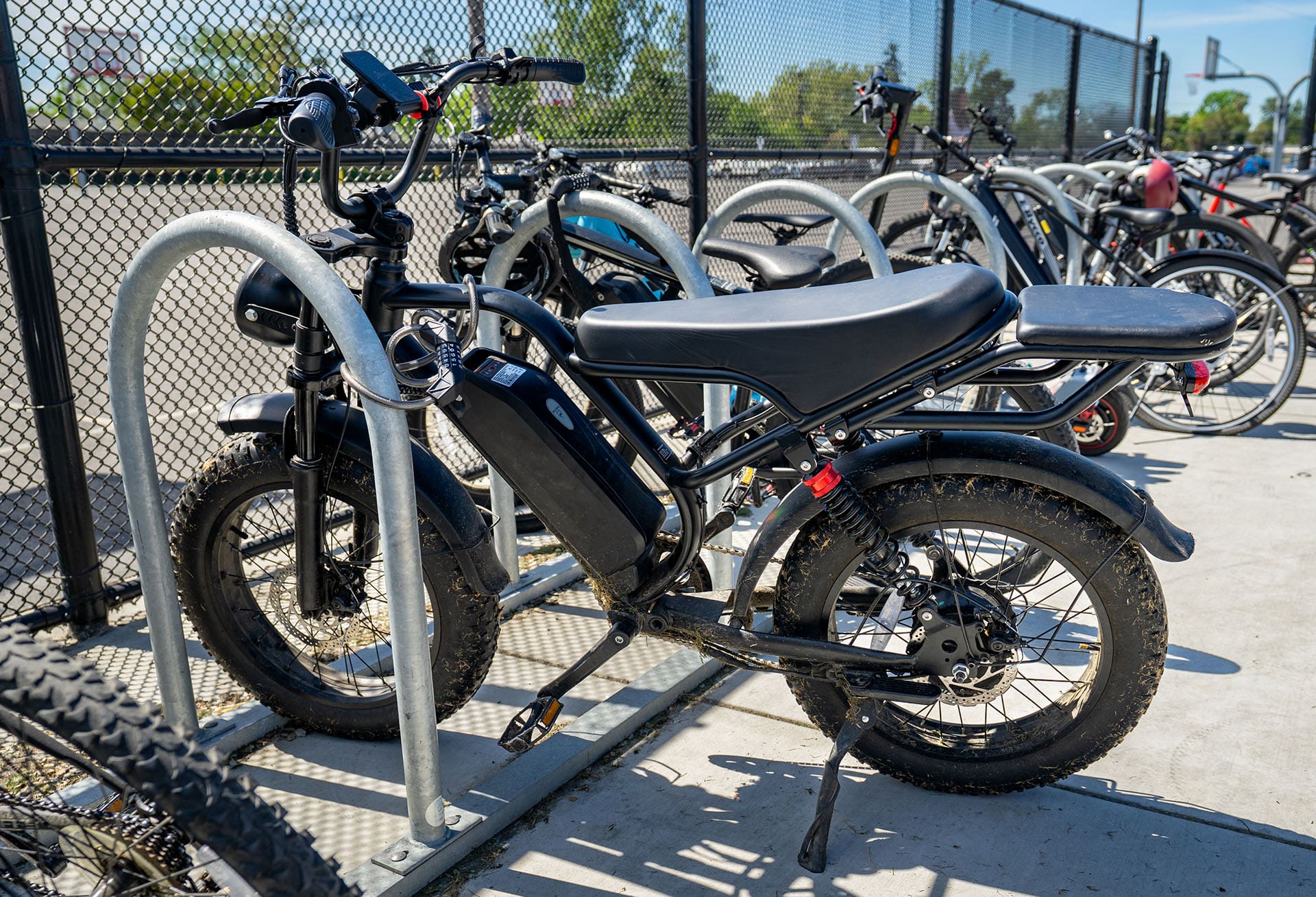 black e-bike on school bike rack