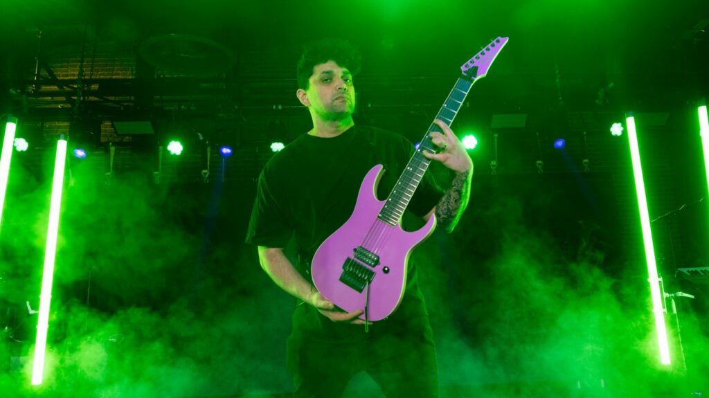 Man holds guitar