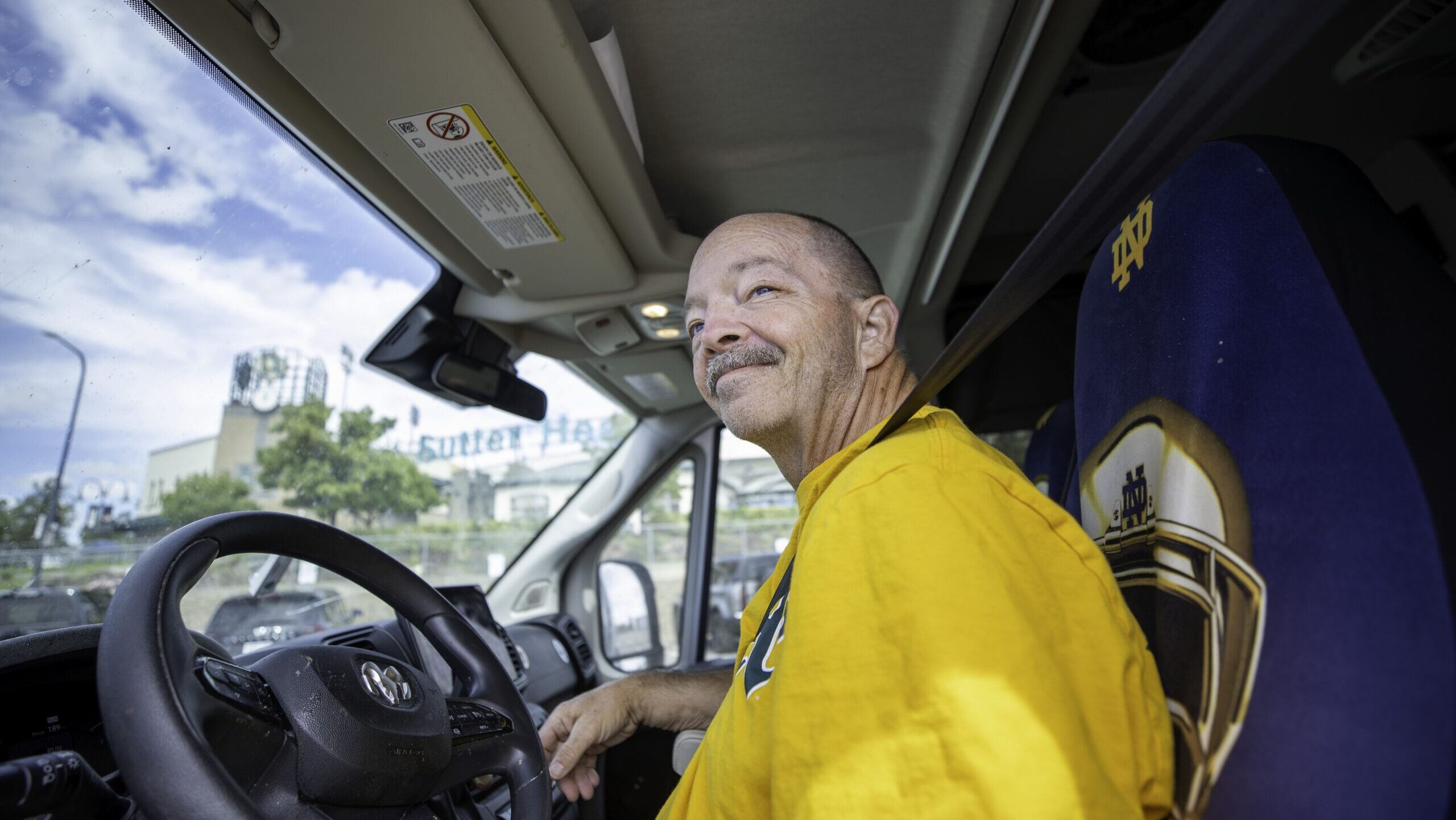 Man sits in driver's seat in his RV.