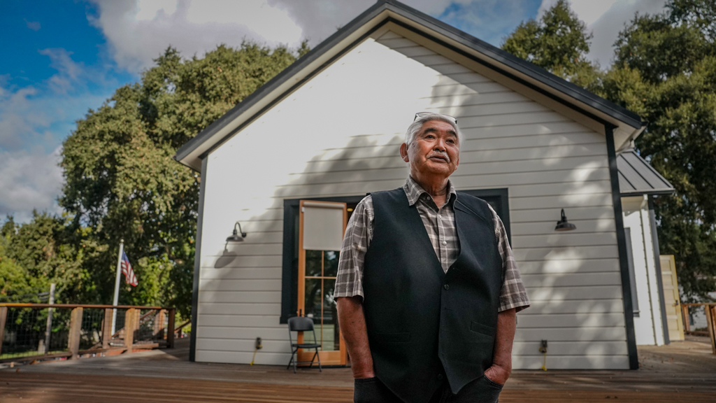 Man in front of community center