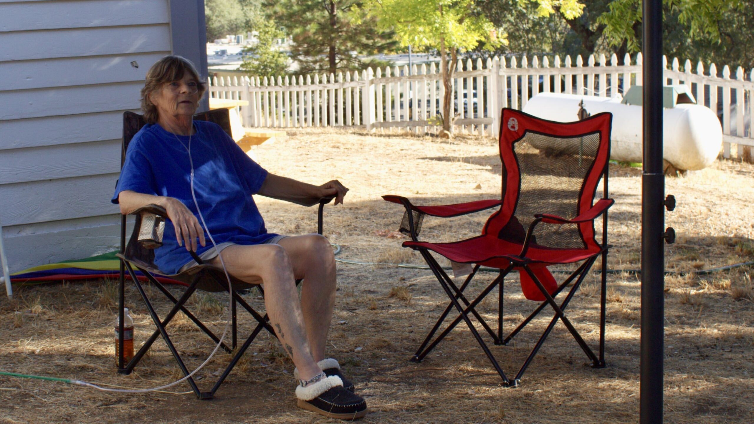 Woman sits outside