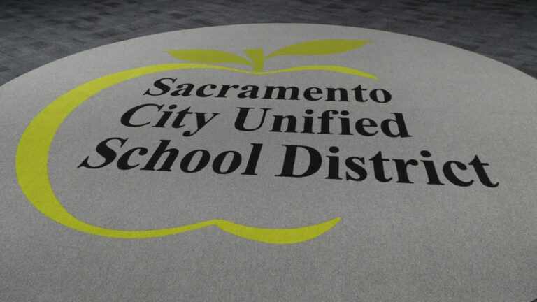 A rug with the Sacramento City Unified logo