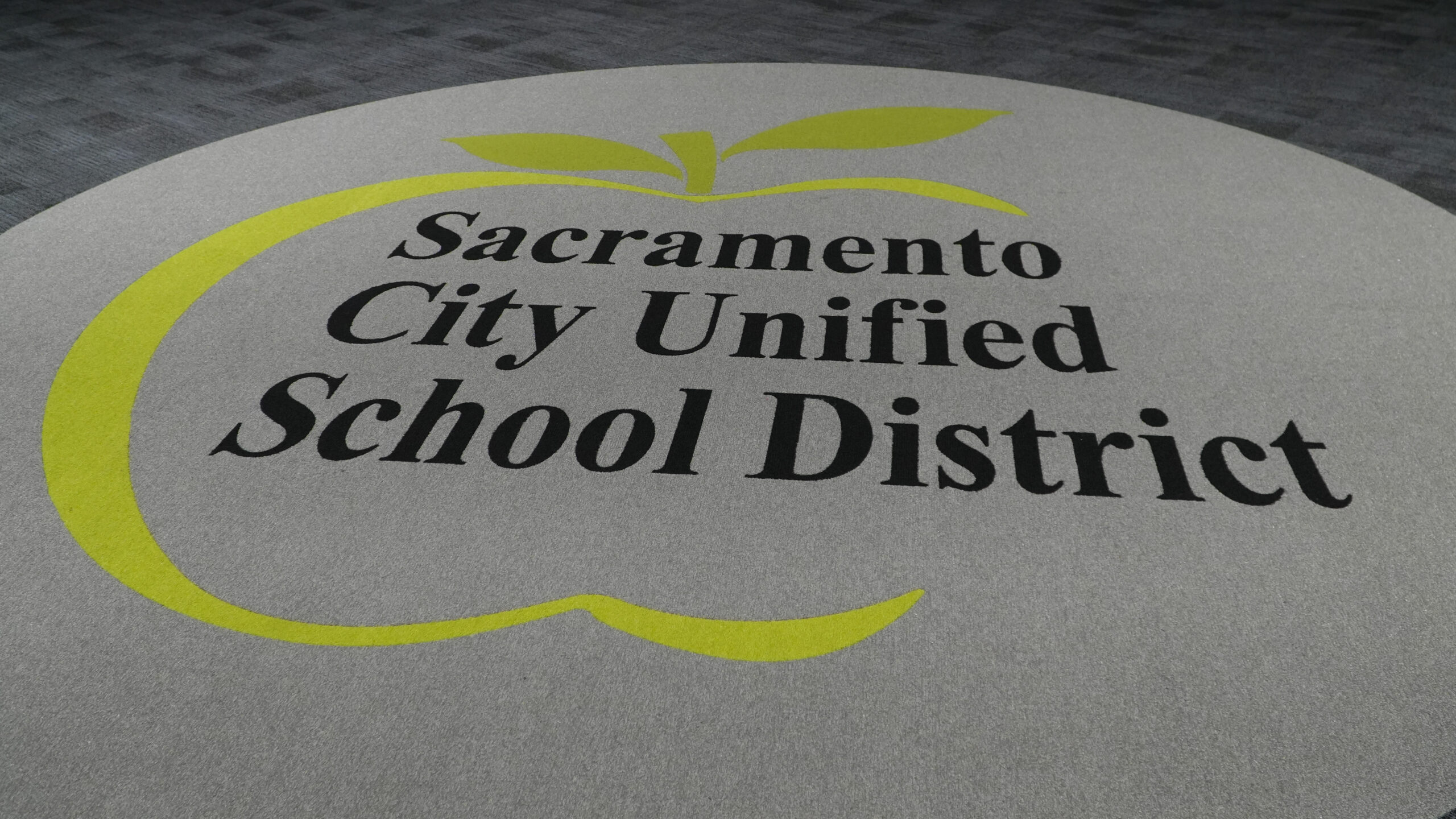 A rug with the Sacramento City Unified logo