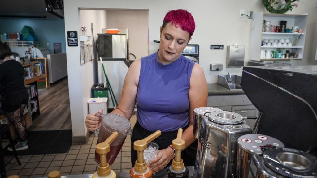 Woman pours a drink