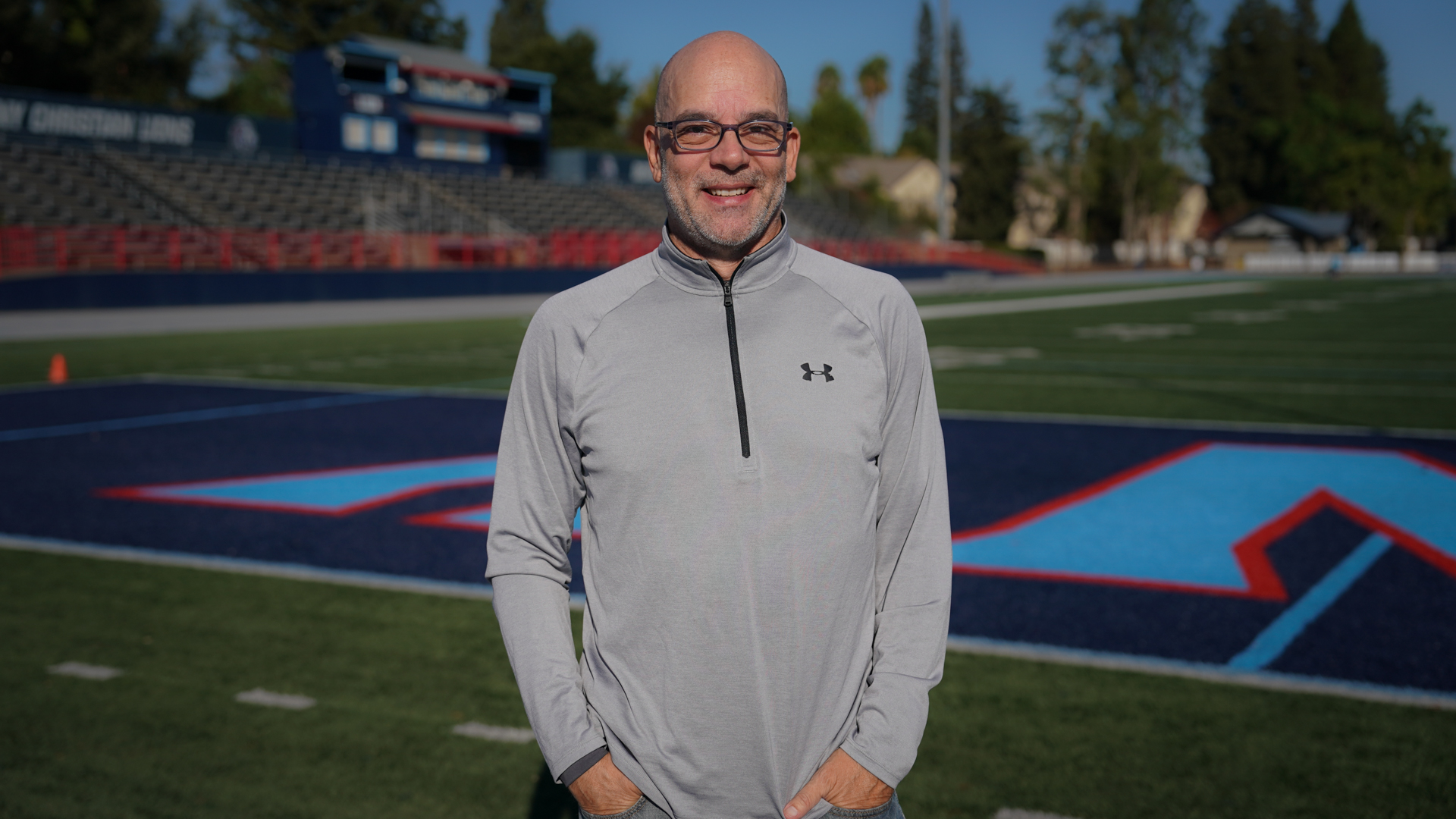 Man standing at football stadium