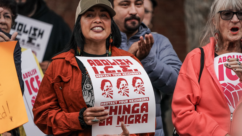 Woman holding sign