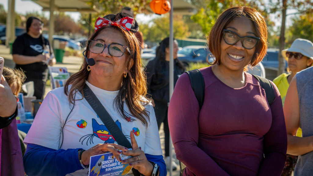 two women attending event
