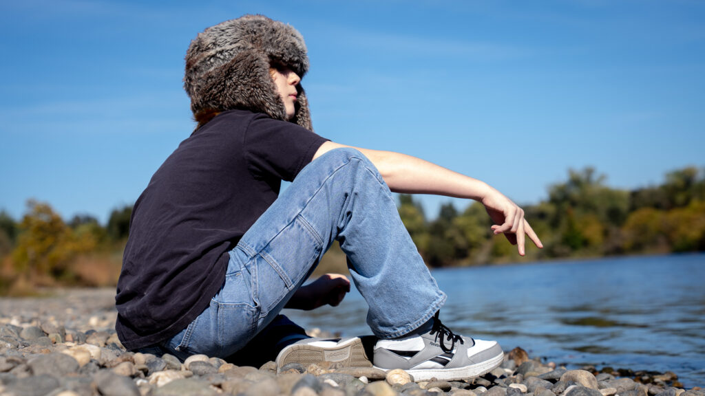 child by river