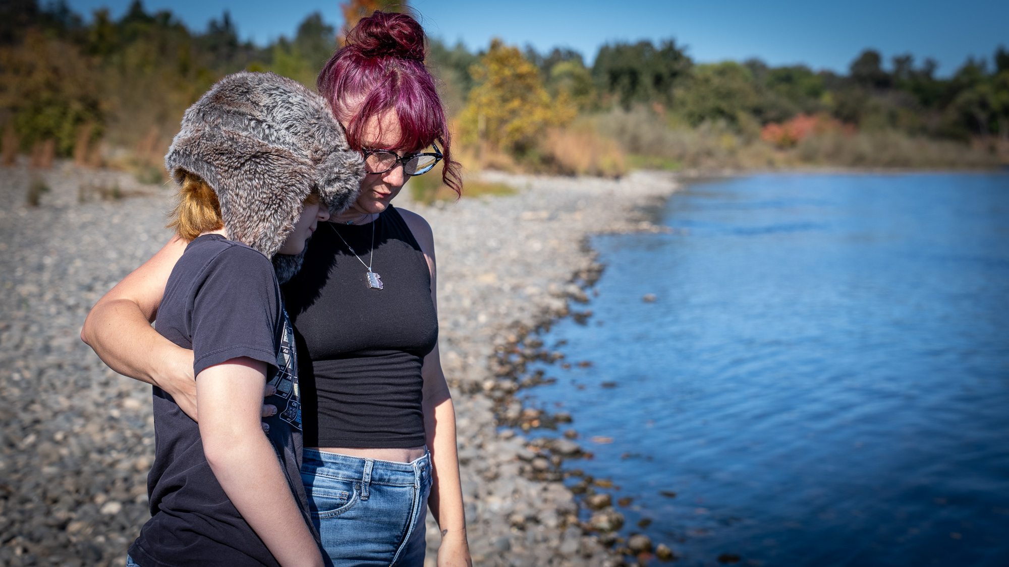 woman and child by river