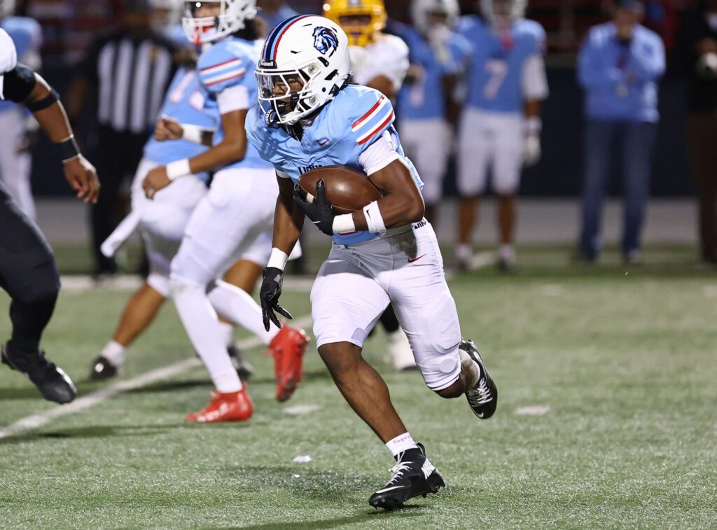 Man runs with football