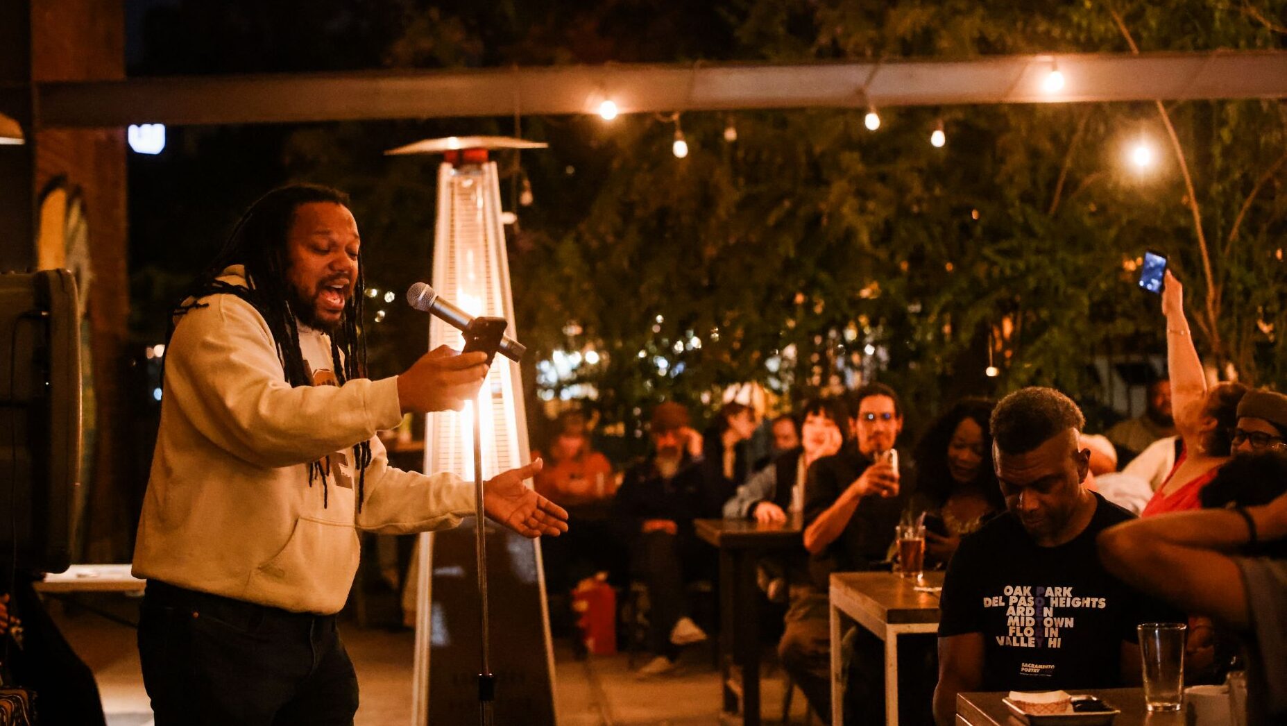 Man speaks at mic