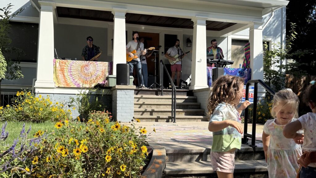 A band plays on a porch