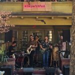 A band plays on a porch